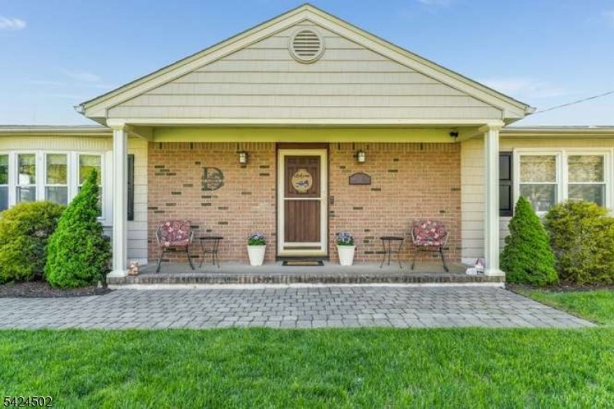 Welcome to this thoughtfully updated 3 bedroom 2 bathroom raised ranch in the picturesque community of High Bridge. The main level offers a family room with new luxury vinyl flooring, a full bathroom, and a spacious eat-in kitchen, featuring granite countertops, a large center island, double ovens, and stainless steel appliances. The kitchen opens to a bright dining room ideal for both entertaining and get togethers. A covered 3 seasoned porch with trex decking extends the living space and provides a comfortable setting for all gatherings. Just a few steps above, the home features a welcoming living room with hardwood floors, three well-proportioned bedrooms, and a full bathroom. A walk-up attic offers extra storage and houses mechanical systems. The ground level includes a flexible recreation area/den currently used as a gym, a generous laundry room, and direct access to the oversized attached 2 car garage. The exterior boasts a blacktop driveway with ample parking, a fenced private backyard, a storage shed, a small pool, and a screened-in porch perfect for outdoor enjoyment. A whole-house generator and public utilities add peace of mind. Conveniently located near schools, NJ Transit to NYC with free parking, and High Bridge's charming Main Street. The home also offers easy access to the Columbia Trail, Lake Solitude, Ken Lockwood Gorge, High Bridge Hills Golf Course, Rt 78, 22, and 31. Residents enjoy free full-day preschool, various town events, concerts, movies and more.