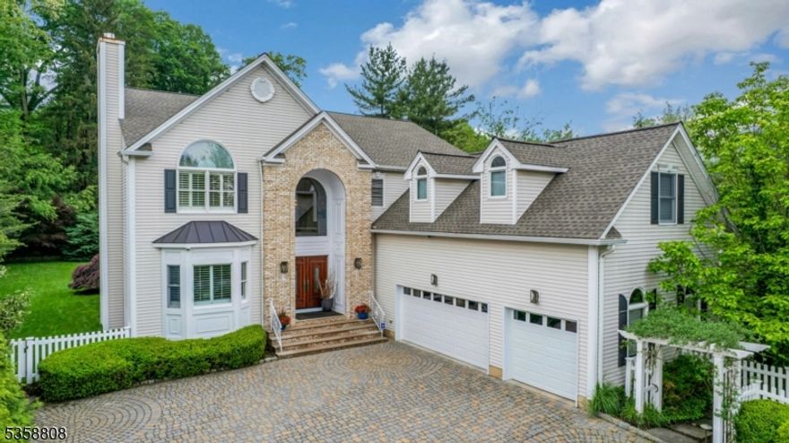 Sophisticated modern Colonial features an open-concept floor plan which flows effortlessly.  The gracious sun-filled Foyer is flanked by the Living Room with fireplace and an elegant Dining Room.  The bright Family Room with its custom finishes  and oversized fireplace overlooks the large, serene property and opens onto the 2-tier Deck.  A stunning Kitchen offers sleek cabinetry, oversized central island, custom beverage bar, sun drenched breakfast area and pantry cupboard.  An Office/ensuite Guest Bedroom and Powder Room complete the first level.  The Primary Suite with Sitting Room, walk-in closet and its luxurious Bathroom will please your most discerning client.  Three spacious Bedrooms, the Hall Bath and Laundry Room round up this floor.  The amazing finished lower level adds a whole extra level of living space featuring a large Media Room, a second Kitchen, Game Room, Gym, Library and Full Bath.