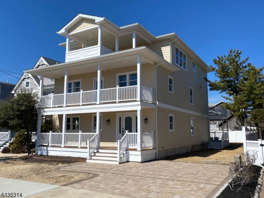 Beautiful COMPLETELY RENOVATED home steps away from the beach with plenty of ocean and bay views! 6 bedrooms and 5 baths in total. Custom Reverse Living with ELEVATOR access to all 3 floors. OPTION to create a Master Suite on second floor which would include Master bath/shower and 13x18 FT WALK-IN CLOSET! Large Front Porch and Back Deck, 2 Front Balconies and 1 Rear Balcony. PANORAMIC Ocean/Bay Views on 3rd Floor Balcony! Huge Kitchen and Living Area on 3rd Floor with Ocean Views all throughout. Kitchen includes Granite Tops, Center Island with oversized seating area, 9-FT WIDE PANTRY, Custom Tiled Backsplash, Under Cabinet Lighting, 6 Burner Stove, Convection Oven, Microwave in Center Island, Refrigerator, Dishwasher, and a Exhaust Hood Direct Vent to outside. Tankless Continuous Hot Water Heater, 3-Zone/2-Unit Heat & Air. Recessed Lighting, Custom Tiled Bathrooms and Hardwood Flooring throughout home. Granite topped wet bar leading directly to back deck. Enjoy the ideal location of this home including the private beach access of Seaside Park, while being only minutes away from the festivities of the Seaside Heights boardwalk!