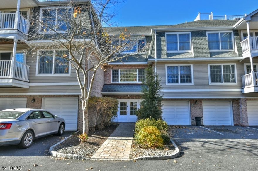 COMMUTER'S DREAM TO NYC-ONE BLOCK FROM TRAIN STATION AND VIBRANT RAMSEY TOWN. Desirable Central Park Place! Come live in this lovely two bedroom, two bath condo with private GARAGE, FRONT DOOR SECURITY and ELEVATOR. Freshly painted, refinished hardwood flooring through out, central air, private laundry, recessed lighting and building security. Sun-drenched open layout with spacious living rm with sliders to private deck. Modern kitchen with granite counters, stainless steel appliances, white cabinetry and breakfast bar overlooking dining area. Primary bedroom has walk-in closet/new organizers and en-suite with stall shower and jetted tub. Second bedroom has double closet with full bath across the hall with shower over tub. Convenient one car garage and extra guest parking. Prime location to enjoy restaurants, shopping and park. Pet Friendly. Cats/dogs under 30 lbs.