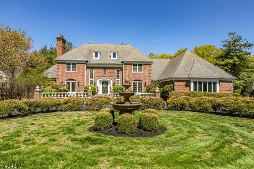 Sophisticated yet welcoming, grand yet livable, this is luxury without compromise. From the moment you arrive via a circular drive anchored by a statement fountain, you're transported to a home that feels timeless and unforgettable, with manicured grounds echoing the elegance of a private European estate. Inside, a dramatic butterfly staircase sets the tone for interiors that balance architectural sophistication with modern comfort. The living and dining rooms feature French doors and bespoke finishes. Sunlight pours through arched windows in the family room, complete with a fireplace and seamless flow to bluestone terraces and resort-style grounds. Beyond the sparkling pool and spa, a lush lawn is ideal for everything from backyard games to tented affairs. The chef's kitchen impresses with premium appliances, dual dishwashers, and extra refrigeration, generous enough to cook, bake, and gather without feeling crowded. Two potential primary suites offer flexibility: one on the main level with outdoor access and a custom closet; another upstairs with a walk-in and private bath. Two additional bedrooms share a hall bath. A laundry room, mudroom, and two powder rooms sit near the four-car garage. The lower level features a bar, wine room, full bath, and walk-out access. A four-zone Sonos system carries music inside and out. Montgomery Township offers top-ranked schools, nearby country clubs, parks, shopping, dining, commuter access, and proximity to downtown Princeton.