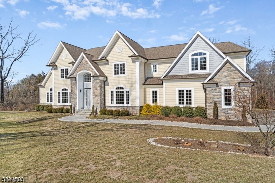 This is a rare opportunity to purchase a builder's own home. Come see this 4-years-young custom colonial, tucked away on a wooded three acre lot, in the highly desirable Basking Ridge section of Bernards Township. The property is located on a peaceful cul-de-sac street, and the nearly 500-foot driveway offers privacy and gorgeous scenery. Walk right in to a sun-drenched 2 story foyer. The first floor includes an oversized kitchen with a large center island which flows into the dining room and living room for entertaining. First floor also includes a private guest room with an ensuite bathroom, formal living room, powder room, mud room, and a 3-car garage. Continue to the second story to find a sprawling primary suite with a spa-like bathroom and an incredible walk-in closet that has direct access to laundry room. Also on the second level, there are 3 additional bedrooms and 2 full baths. The back deck is an entertainer's dream. No expenses were spared during construction, including Superior foundation walls, Anderson composite windows, 2x6 exterior walls, 12" solid wood framing, LP SmartSide wood-board siding, and commercial size 6" gutters. All-LED lighting, 2-zone Ameristar HVAC, and highly-rated insulation make for an incredibly energy-efficient home that is fully backed up by a whole house Kohler generator. Owner will proudly share copies of monthly utility bills. The meticulously planned plumbing system is so important in a home that is supported by septic and well.