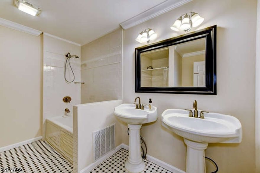 Tucked into one of South Plainfield's most sought-after pockets, this freshly painted magnificent 5 bedroom, 5 bath residence offers the kind of space, warmth, and thoughtful design that is genuinely hard to find. From the moment you arrive, the graceful portico sets the tone, framing the entrance with architectural elegance that hints at everything waiting inside. Step through the front door and the home opens up generously, with natural light and fine finishes flowing through every room. The dedicated library is a standout feature, an intimate and inspiring space perfectly suited for working from home, quiet reading, or a private study. Five bathrooms mean that busy mornings run smoothly and guests are always comfortable. TWO options for a primary suite! Circular driveway, 3 car garage, two balconies. This location places you close to major commuter routes, top-rated South Plainfield schools, and the everyday conveniences of Route 22, Route 28 and 287 without sacrificing the quiet residential feel that makes this neighborhood so special. This is not just a house. It is the lifestyle upgrade you have been waiting for. Open houses 4/25 & 4/26 1pm-3pm both days