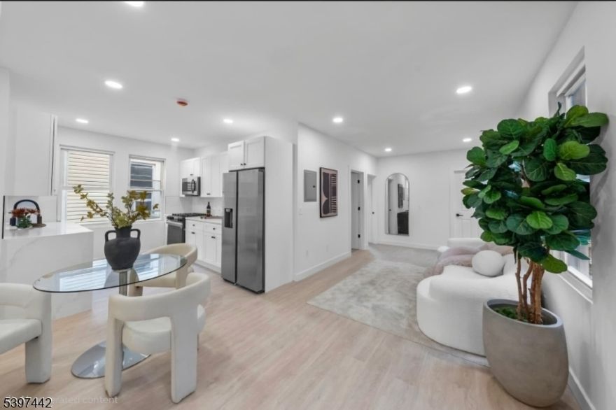 Discover an incredible investment opportunity steps from the Danforth Light Rail, offering the perfect balance of income potential and modern comfort. This 4 family property features four thoughtfully designed apartments with timeless finishes and spa like interiors, making it an ideal fit for both investors and owner occupants looking to house hack. Each unit is laid out with care and modern appeal three apartments offer 2 bedrooms and 1 full bath, while the fourth unit provides 3 bedrooms and 1 bath, perfect for a larger household or owner?s suite. Every residence includes in-unit washer and dryer, contemporary kitchens, and serene, hotel-inspired bathrooms that feel like a private retreat. The property also includes two bonus basement units offering extra flexibility. Outside, enjoy a detached 3 car garage providing coveted parking and additional storage. Located in the heart of Jersey City?s close to Danforth Light Rail station, this home offers effortless access to Downtown Jersey City, Hoboken, and Manhattan all while being surrounded by local shops, schools, and parks. Highlights: - 4 legal units + 2 bonus units - Three 2BR/1BA apartments, one 3BR/1BA - In-unit hook-up laundry for every residence - Timeless modern design, spa-like bathrooms - Detached 3-car garage - Convenient access to NYC via Danforth Light Rail