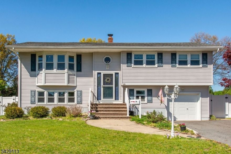 Beautifully updated 4-bedroom, 2.5-bath bi-level home with an in-ground pool, set on a spacious property in the desirable Greenview Park section of Pequannock. Renovated in 2018, the kitchen and bathrooms blend modern style with everyday functionality. The main level features a bright, open-concept layout with a large living room, dining area, and a stunning kitchen complete with quartzite countertops, stainless steel appliances, custom cabinetry, a stylish backsplash, and a center island with pot filler perfect for cooking and entertaining. Down the hall, the primary suite offers an updated ensuite half bath and generous closet space, accompanied by two additional well-sized bedrooms and a fully renovated full bathroom.The lower level provides a versatile, fully finished space ideal for extended living, a home office, or recreation. It includes a spacious living area with sliders to the backyard, a kitchenette, laundry room, and an updated full bath. Step outside to your private backyard retreat fully fenced and designed for entertaining with an in-ground pool, large deck, patio, and storage shed. Additional features include hardwood floors throughout, new windows, updated electrical and plumbing, a new garage door, expanded driveway, and a generator hookup.Located in a community known for its excellent schools, scenic lake, walking and biking paths, and convenient access to major highways and shopping this home truly offers the best of comfort, style, and lifestyle.