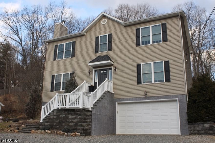 Brand New home Built from the ground up with new foundation in 2010. Beautiful center hall colonial. Located in prestigious Peapack NJ. The home is a short trip to town and to the NYC train. 4 BR 3 full baths 1 half, finished walk out basement. 2 zone heating and cooling. Large 2 level paver patio. Tons of upgrades! Home has custom window trim kit , crown molding, granite counters, oversized master suit with kohler whirlpool tub. All fixtures upgraded Kohler. Whole house humidifier, water filter and water softener. Central monitored alarm; security cameras. Oversized 2 car garage. Do not miss this home!