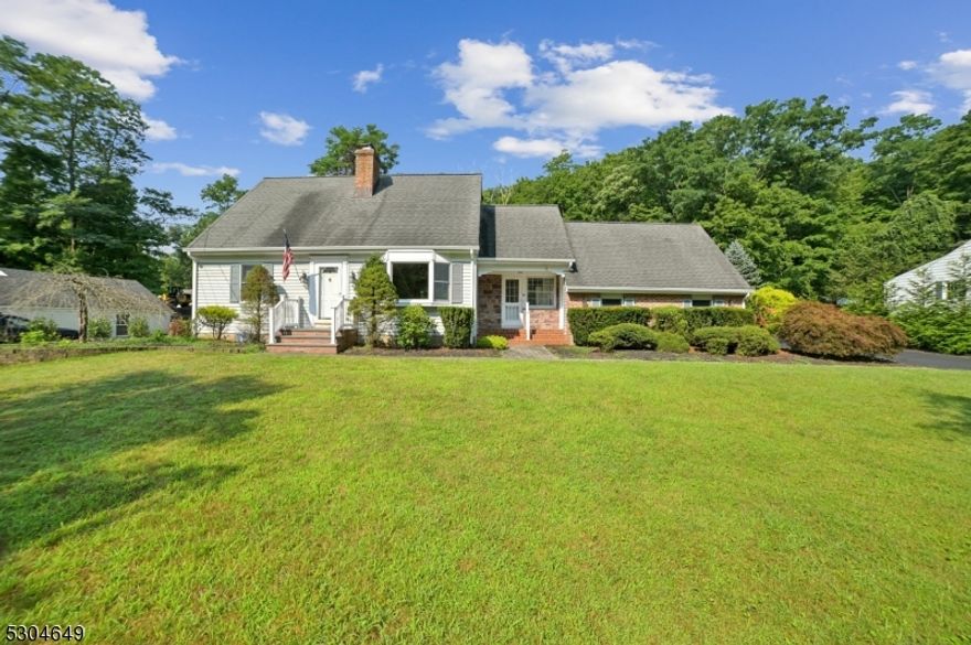 Nestled in sought-after Boonton Township, this Cape Cod home checks all the boxes. Featuring 4 bedrooms and 3 bathrooms, this property offers the convenience of public utilities and the serenity of a 1-acre lot. The home has a full finished basement with a wood stove and bar, perfect for entertaining and a paver patio for your next outdoor gathering. The two-car garage with walkup loft storage provides ample space for all your hobbies.  Additional parking ensures convenience for guests. This home is located near shopping and highways where you'll enjoy easy access to everything while still relishing the country-like setting.