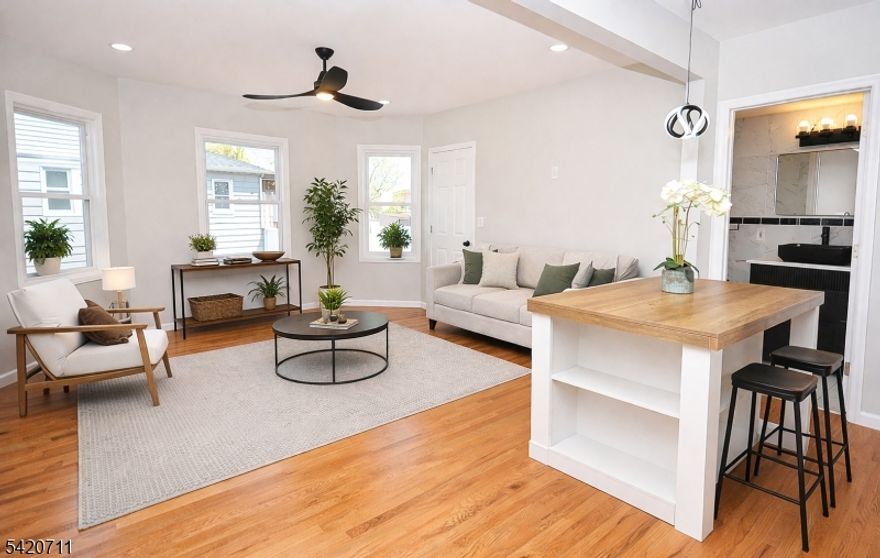 Beautiful fully renovated 1-bedroom, 1-bath first floor unit on a quiet tree lined street. This modern apartment features a bright open concept layout with an eat-in kitchen that flows into the living room. The brand new kitchen offers quartz counters, modern appliances, dishwasher, large workstation sink, pantry, and a moveable island with seating for two. Ample closet space throughout plus all new flooring, windows, doors and lighting. The updated bathroom showcases a sleek vanity, statement mirror and lighting, floor-to-ceiling tiled walls, and an oversized shower stall accented by a generous wall niche. Enjoy a private back porch which is perfect for morning coffee or unwinding at the end of the day. Spacious back yard perfect for entertaining or enjoying a flower garden. Renovated 2-car garage available for rent separately, one or two spaces. Exterior improvements include a new roof, siding, stone front, and a front porch being renovated with composite decking and new railings. Renovation work will be completed soon. Ideally situated within a half mile of the Netherwood train station, offering an effortless commute. Conveniently close to major highways, shops, dining, and scenic parks with walking paths. Rent includes gas, water, sewer, and garbage removal. Tenant pays electric and is responsible for snow removal. No pets.