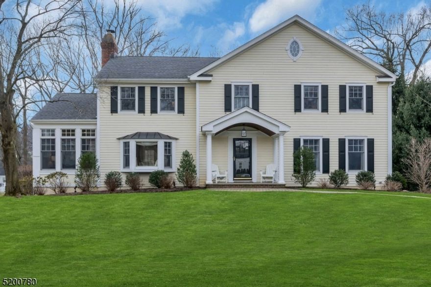 Welcome to this stunning Wickham Woods Center Hall Colonial. With 5 bdrms, 3.1 baths, hardwood floors throughout, walk out basement, first floor office, & newer white kitchen, this is the home you've been searching for! The open floor plan is perfect for entertaining and enjoying the large level lot. The formal dining room opens to the kitchen and family room w/ doors to the two tiered mahogany deck. The laundry/mudroom is right off the kitchen w/ direct access to the outside.Also open to the FR is a large LR complete with fireplace, built ins, & wet bar. Glass french doors lead to an oversized office with tons of light and high ceilings. The second floor boasts 4 bedrooms, an updated hall bath, walk in closets, and access to the attic. The primary bedroom has generous closet space incl. a walk in, separate vanity area, and updated private bath. The walk out basement is bright & sunny with sliders to the outside and a bedroom w/ tons of windows and a full bath attached. The 2 car garage easily fits 2 cars and lots of storage. Improvements include: new exterior steps, new garage doors, 2020 kitchen renovation incl. quartz counters, stainless steel Kraus sink, new disposal & instant hot water, new oven and microwave, new Wolf cooktop, & a stainless steel hood. New roof & hot water in 2015. Hardie siding, Azek trim & new windows complete this move in ready home! Enjoy this active neighborhood, close to town, train, and top rated Chatham schools.