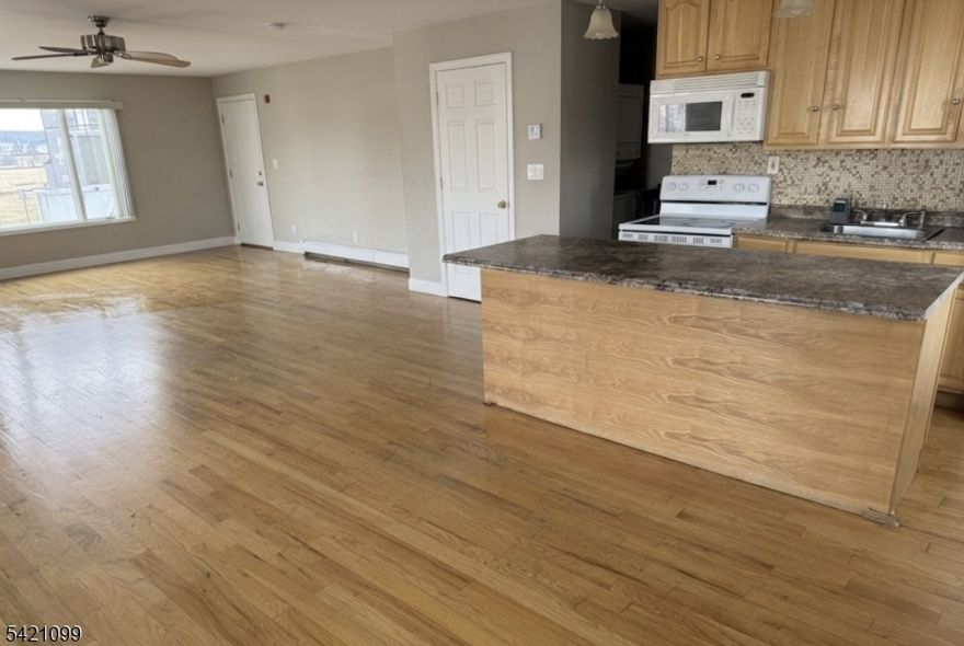 This beautifully spacious, updated studio is nestled in the heart of the vibrant Elmora section of Elizabeth with tenant responsible for Electricity, owner pays gas and water! Enjoy wood flooring, modern finishes with Island, washer/dryer in unit, one designated parking spot!. With its own private entrance,  abundant natural light, and unbeatable convenience, just steps from local shops, restaurants, and NJ Transit options. Bus stops are just 2 minutes away (Lines 48, 112, 115, 59) with service from early morning to late night. Elizabeth Train Station is approximately 0.9 miles away (NEC/NJCL), offering a 35-minute direct ride to NYC and seamless connections between bus and train via NJ Transit. Great elementary and middle school options nearby, including Woodrow Wilson and Dr. Orlando Edreira Academy. A Blue Ribbon School is also close by, providing access to top-rated education. Multiple high schools are located within 1 mile, such as Elizabeth High School and Hamilton Preparatory Academy. This is a fantastic opportunity for commuters or anyone looking to enjoy city living with suburban comfort.