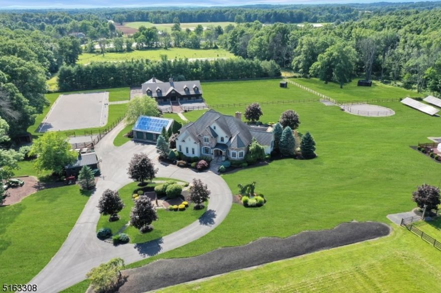 *TOO MANY AMMENITINES TO LIST* SPECTACULAR 36.81 acres of pasture & woodlands! THREE LEVELS of FINISHED LIVING SPACE! (enclosed porch, LARGE basement)  $200,000 SELLER OWNED SOLAR SYSTEM! 4 bedroom, 3 full 1 half bath luxury manor in immaculate condition. Equestrians will appreciate the thoughtfully planned setting of facilities which include: an amazing custom 8 stall (12x12) center aisle barn by the acclaimed B&D Builders, heated tack room/lounge/office, heated feed/storage/utility room, wash stall w/ hot water, storage/equipment area & full overhead loft. Stroll over to your own 90'x220' OUTDOOR RIDING ARENA w/ stonedust footing & outdoor lighting for all weather riding which includes a 20mx60m Dressage Arena. A 60' training round pen, 4 fenced stone dust paddocks w/ individual run-in sheds, 4 lush grazing pastures & on property riding trails complete the fully turnkey amenities.  Not to be missed is the detached oversize 3 car garage & additional detached 2 car garage for ample storage to impress any collector or hobbyist. Solar panels facilitate green living as well! No electric bill.