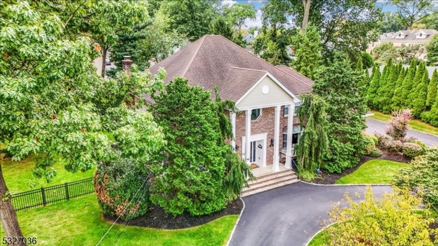 Imagine living in this extraordinary Colonial in Westfield, where modern luxury meets relaxed living on a pristine half-acre lot in one of NJ's most desirable towns. This meticulously updated home offers comfort and sophistication, starting with a striking double-height foyer and flowing seamlessly into open, airy living spaces.The kitchen, equipped with high-end stainless steel appliances and polished hardwood floors, opens to the cozy family room with a gas fireplace, perfect for relaxing evenings. Host gatherings that transition effortlessly from the bright interiors to the large deck overlooking a private, tree-lined backyard ideal for entertaining or quiet moments.The first floor includes a bedroom, full bath, and laundry room, offering convenience for guests or multi-generational living. Upstairs, the home features four spacious bedrooms, including a luxurious primary suite, updated in 2019, with tray ceilings, mood lighting, two skylit walk-in closets, and a spa-like bath.The finished basement provides a home gym, media room, or rec space, plus a 200-bottle wine fridge, newer powder room, and customizable unfinished space. An oversized two-car garage adds storage, and with easy access to two train stations for a quick NYC commute and lower taxes, this home offers unmatched luxury, space, and convenience.