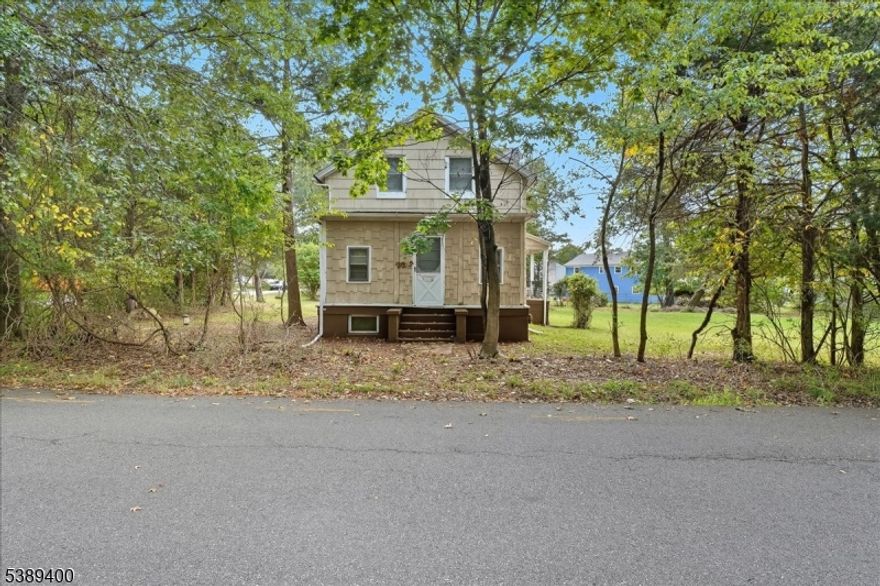 Welcome to this rare renovation opportunity on a spacious corner lot just minutes from Rutgers University's College Avenue Campus. Ideal for investors, developers, or buyers ready to update a home and bring their vision to life. The first floor features a generous living room with hardwood floors, a versatile bedroom or office, a kitchen, a full bath, and an additional room off the kitchen that could easily become another bedroom. Upstairs, you'll find three bedrooms with the option to restore the original four-bedroom layout, a half bath, and a storage closet. The unfinished basement houses all utilities, including a new boiler installed a few months ago, an above-ground oil tank, water heater, and well water filtration system, with a Bilco door providing convenient outdoor access. Outside, the property offers a detached one-car garage and a large yard with room to expand perfect for outdoor living or future improvements. Conveniently located near Rutgers University, major highways, shopping, and local schools. The home is being sold strictly as-is, with all township certificates of occupancy the buyer's responsibility.