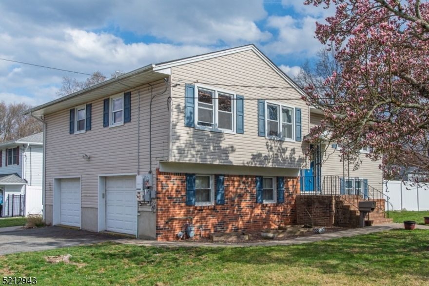Lovely, immaculate 3 bedrooms, 2 baths Bi-level in a wonderful residential section in Parsippany, beautiful cherry blossom tree welcomes you to this beautiful home. Walk into the impressive freshly painted cathedral ceiling foyer.  Upstairs has three nice sized bedrooms, hardwood flooring in living, dining room, foyer and steps, massive renovated bathroom upstairs with newer windows, carpeting in two bedrooms, bright and airy with skylight, recess lighting, moldings, renovated kitchen with stainless steel appliances, plenty of cabinets for storage, formal living room has gas fireplace & dining room with custom sliders that lead to an enormous deck for entertaining, downstairs has a renovated family room, renovated full bath with tub/shower, lovely walk in closet and another set of sliders to paved patio.  Also, on the lower level is the laundry room, den or possible fourth bedroom, two car oversized garage, amazing custom courtyard for those summer, spring, fall & winter functions, literally your own private oasis, gas natural, public utilities, some fencing, corner lot, dead end street & solar panels that make your electric bill very minimal.  Easy access to all major routes, 80, 46, 10, 202, restaurants, shopping & park nearby.  Don't miss out on this one! Estate sale strictly sold "As Is.,  All appliances, furnace, hot water heater, microwave, gas range, central air conditioning system are as of 2009, except deck. Sliders in dining room are only 2 year's old.