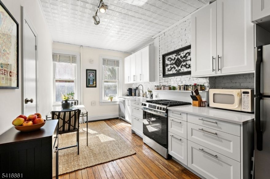 Welcome to 351 8th St, a charming 1-bedroom, 1-bathroom condo nestled in the Hamilton Park section of Jersey City. This inviting home offers a perfect balance of modern convenience and comfortable living in a thoughtfully designed floor plan.Step inside to discover elegant hardwood floors and exposed brick that flow seamlessly throughout the space. The open sun filled kitchen is beautifully appointed with stainless steel appliances, including a dishwasher and new range offers the added convenience of an eat-in layout, perfect for casual dining. The living area provides a welcoming space to unwind, while the additional rooms offer flexibility for work, leisure, or entertaining.Outside, enjoy access to a shared backyard oasis, complete with a barbecue area for dining, relaxing and socializing. Practicality meets convenience with a private storage room, dedicated laundry facilities, and ample shared amenities designed to simplify daily living.Situated in an enviable location brimming with local charm and convenience, this home offers an unparalleled lifestyle. Whether you're seeking a tranquil retreat or a vibrant space to entertain, 351 8th St is a rare gem that promises to captivate. Make this inviting space your new home and experience the very best of Hamilton Park living.