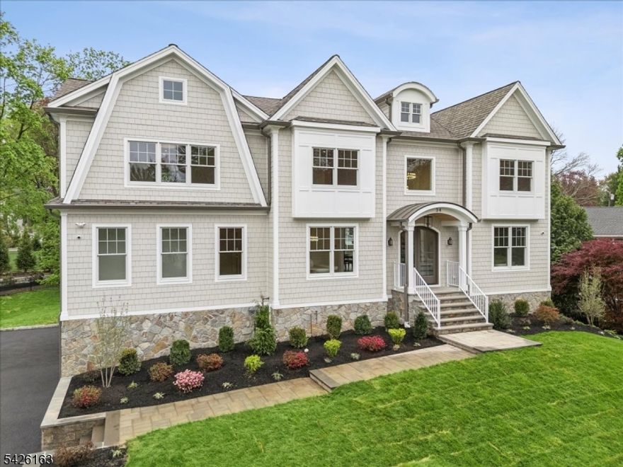 Experience exceptional new construction by a reputable builder with a true vision for modern luxury living. This stunning home offers 7 bedrooms, 7.5 baths, and three levels of thoughtfully designed living space, featuring high-end finishes throughout. The first floor showcases a traditional layout complemented by a conveniently located bedroom or private office, mud room and appliance pantry. The lower level is designed for both relaxation and functionality, complete with a wellness room, recreation space, additional bedroom, and kitchenette. Highlights include white oak floors, top-of-the-line appliances, custom cabinetry, a full house generator, and countless upscale details. A rare opportunity to own a beautifully crafted home on a picturesque, tree-lined street in the heart of charming Madison with convenient access to NJ Transit/NYC direct train