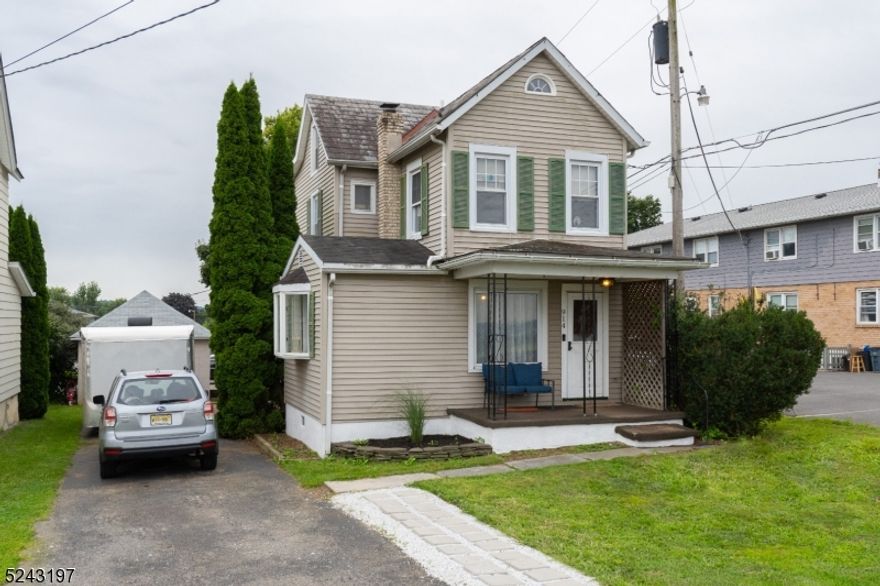 Come and see this bright and cheerful 3 bedroom colonial. This home boasts lots of character with wainscoting, crown molding, and hardwood floors upstairs. The upstairs has 3 bedrooms, 2 of which are railroad style, full bathroom, and a walk up attic for easy storage. Exterior features 2 covered porches, patio space in the backyard, and a large detached garage with ample additional parking.