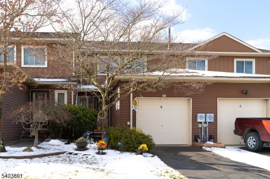 This 2-bedroom, 2.5-bath townhome offers an inviting first floor with hardwood floors throughout the main living areas. The kitchen features granite countertops and opens to the dining area and family room, where sliding doors lead out to a spacious deck overlooking green space. Upstairs, both bedrooms are generously sized, including a primary suite with a private bathroom. Additional full-bath in upstairs hallway. A finished basement provides flexible additional space for a home office or recreational area. Laundry room in basement. 1 car attached garage accessible from first floor. This neighborhood is conveniently located near shopping, dining, and major roadways. Access to community amenities including a pool, tennis courts, and playgrounds. Comfortable, low-maintenance living in a well-established neighborhood.