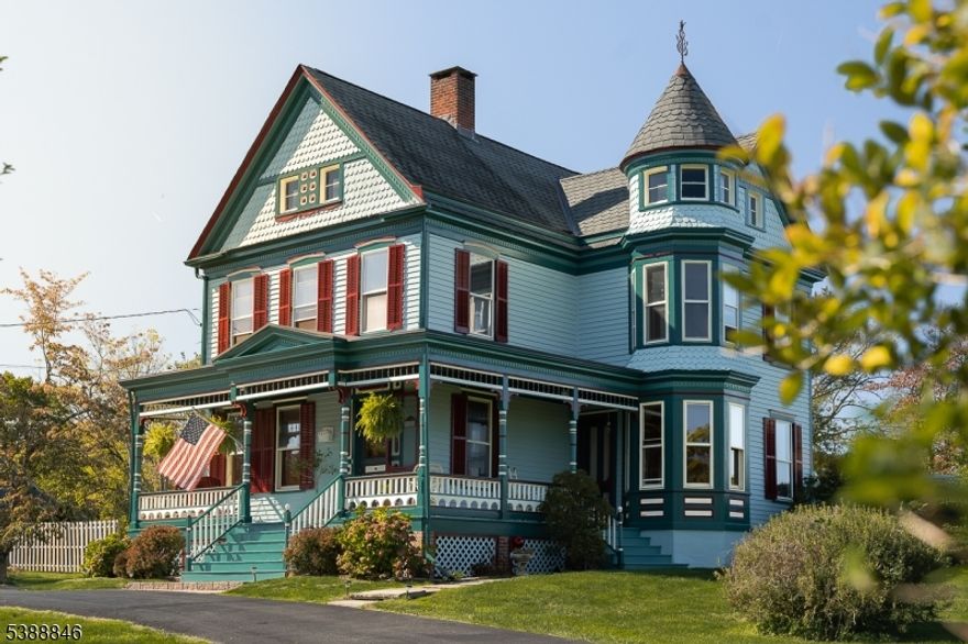 This 1894 Queen Anne Victorian stands as one of Tewksbury's most iconic homes and a beautifully preserved example of early american architecture. Step into history with its signature wraparound porch, intricate millwork, and striking five-color exterior (freshly painted in 2025), every detail celebrates craftsmanship from another era. Inside, original moldings, pocket doors, hardwood floors, and elegant bay windows frame rooms filled with natural light and character. The home offers four bedrooms, 1.5 baths, and a walk-up unfinished third floor brimming with potential, perfect for a studio, playroom or additional living space. A detached garage and versatile outbuilding add flexibility for a workshop or office. Located in the heart of Oldwick, this residence is more than a home, it's a piece of the town's rich architectural story, lovingly maintained and ready for its next chapter. On the market for just the second time since 1894.