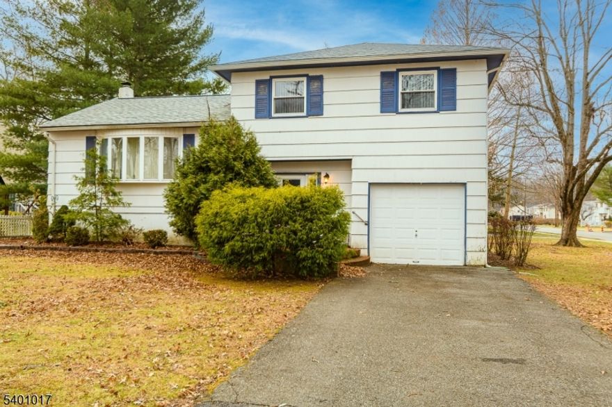 Welcome to 4 Herbert! Nestled in the sought after Gardens section of West Caldwell, this well-maintained split-level home sits on a generous corner lot and offers wonderful potential to expand, update, or enjoy! Step through the open foyer into a spacious FR, complete with access to an unfinished bmnt. perfect for creating additional living space, gym, or playroom. This level also features a convenient powder room and laundry room.Up a short flight of steps, the first floor welcomes you with a bright LR and DR accented by gorgeous cathedral ceilings, creating an airy and inviting atmosphere. The updated kitchen provides modern comfort and easy flow to the upper level, where you'll find 3 BR and 1 FB. With this large corner lot, you'll have ample room for gardens, outdoor entertaining, pool, or potential expansion.Your vision can truly come to life here. Additional highlights include property taxes under $10,000 and the incredible lifestyle that comes with living in West Caldwell. Enjoy walkability to two supermarkets, including the brand-new ShopRite plus local shopping and restaurants. Close proximity to public transportation. Nature lovers can take a peaceful stroll to Richard Park, located right within the community. The Gardens neighborhood is known for its quiet, secluded feel and minimal through-traffic, making it a serene place to call home.Topping it all off is access to West Caldwell's highly regarded public schools. Do not miss out on making 4 Herbert your new home!