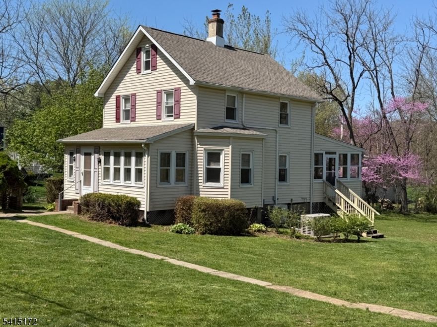 Charming Colonial on .91 acres located on a non-thru street in Towaco.  Home offers an enclosed front porch, can be den or used as office, mudroom leading to a foyer w/ tiled flooring.  Living room with ceiling fan, Dining room with hardwood floor leading to a large heated sunroom with skylights that you can enjoy year round with views of the backyard.  Updated electric in 2023, Hot water heater in 2016. Full finished walk-up attic that has possibilities.  Some newer windows. All house Kohler generator.  Central Air.  Roof replaced approx 1 yr ago.  Well pump 2-3 years old with water softener.  Water hookup in in street near mailbox.  2 car garage and storage shed.  Home is located minutes to train station, major highways, schools, shopping.Home is an estate being sold as is