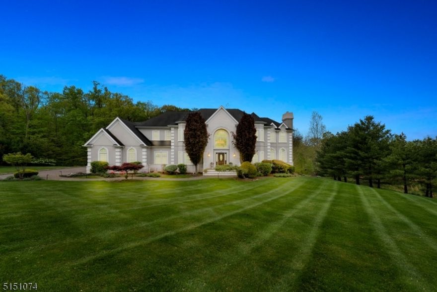 BACK ON MARKET - BUYER COULDN'T PERFORM.   Strawberry Lane is one of the most sought-after streets in Warren and, at 6000 sq. ft. on just over 2.5 acres, this spectacular home is the Grande Dame of them all.  Walk into a beautiful, two-story foyer, which leads to a home that is made to live and enjoy with your loved ones.   As you enter, you flow directly into the huge family room, with high ceilings, fireplace, and direct access to the large deck.  The eat in kitchen boasts a large island, plenty of storage, a chef's stove, butler's pantry, and access to a large laundry room.  For those special occasions, the elegant dining room with its ambient lighting and beautiful wainscotting offers the perfect setting.  An ensuite bedroom, formal living room, and office with an elegant gas fireplace, completes the first floor.   The second floor can be accessed either through the kitchen or up the elegant front staircase, the upstairs landing offers a vantage point to both the foyer and family room.   The large primary suite is as sweet as they come; fireplace, sitting area, 2 walk in closets and large master bath with soaking tub and large shower.   The 4 guest bedrooms each provide access to ensuite baths and large closet space.   The outdoor space, with a huge deck, is conveniently accessible through the kitchen and family rooms, providing that awesome indoor/outdoor feel.   The walk out basement is the entire length of the home and is ready for you to make it your dream space.