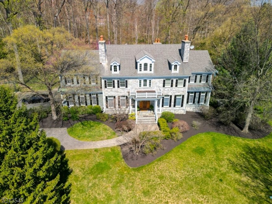 This exquisite colonial home boasts sophistication, seclusion, and serenity both indoors and outdoors. The property is stunningly situated on a 2+ acre lot within a charming neighborhood, affording majestic mountain views and a flat backyard featuring a beautiful patio and resort-style pool. Upon entry, one is immediately struck by the attention to detail that led the NJ Builders Association to award this home the title of "Best Custom Home of The Year"! The remodeled custom kitchen boasts a generous island, marble countertops, two sinks, top-of-the-line appliances, and a delightful eating area overlooking the secluded backyard. The TWO butler pantries lead into the formal dining room, making entertaining a breeze! The custom office with elegant French doors provides a delightful workspace from home. The 10-foot ceilings, three fireplaces, and hardwood floors throughout further enhance the luxurious ambiance of this home. The first-floor guest suite with full bath is a delightful bonus space! The second floor houses five bedrooms, including the primary suite with a refined sitting room and spa-like bathroom. The finished basement features daylight windows, another full bathroom, a remarkable gym, and an abundance of additional recreational space. Conveniently located close to shopping, commuter rails, and highways, and a proud part of the award-winning Basking Ridge School District!