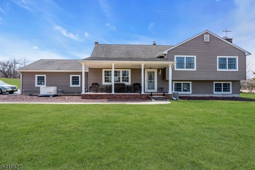 Welcome to your private countryside retreat in the Sourland Mountains, where charm, comfort, and endless possibilities come together on almost 20 breathtaking acres. This inviting 4-bedroom home offers warmth and character throughout, highlighted by a cozy fireplace and a wood stove, perfect for gathering on cool evenings. Thoughtfully equipped with a whole-house generator, the property ensures peace of mind year-round. Beyond the home, you'll find a collection of well-maintained barns, a spacious workshop, and multiple outbuildings including a chicken coop all with electricity making this an ideal setting for hobbyists, farmers, or anyone seeking space to create and grow. The expansive, farm assessed land includes a pond and offers incredible potential for horses, cattle, or agricultural pursuits, while still providing plenty of room to simply enjoy the beauty of nature. Picture yourself unwinding in the swing beneath a charming pergola, shaded by lush, grapevines a perfect spot to relax and take in the serene surroundings. Whether you're looking for a working homestead, a peaceful escape, or a property with room to dream, this unique offering delivers it all.