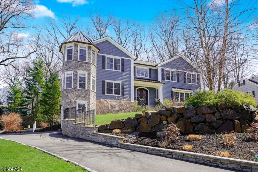 This exceptional custom colonial in Summit's top-rated school district combines luxury and comfort, with easy access to Manhattan via train. The home boasts striking curb appeal, soaring ceilings, an open floor plan, and abundant natural light throughout.The gourmet chef's kitchen features premium Wolf and Sub-Zero appliances, a large center island, and sleek quartz countertops, seamlessly flowing into an elegant dining room with a built-in buffet. The family room, with coffered ceilings and a gas fireplace, opens to the private backyard, perfect for both relaxation and entertaining. A guest en-suite, half bath, and an additional living room complete the first floor, providing ample living space.Upstairs, the primary suite offers a tray ceiling, custom walk-in closet, a sitting room, and a spa-like bathroom with double vanities, a soaking tub, and a marble shower. Three additional generously sized bedrooms share beautifully appointed bathrooms.The finished basement adds even more space, with a bedroom, full bath, and rec room. The three-car garage, with direct access to the basement and a mudroom, is equipped with a Tesla charger and an EV-ready outlet for added convenience.The private backyard features a stunning blue stone and paver patio with a gas hookup for a BBQ, offering an outdoor oasis for tranquility.With its prime location, top-rated schools, luxurious finishes, and spacious design, this home offers the perfect blend of style, comfort, and convenience.