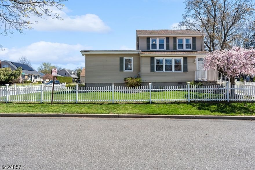 Nestled on a desirable corner lot in a quiet, neighborhood, this exceptional home is the one you've been waiting for. With 5 bedrooms and 2.5 baths, the thoughtfully designed layout provides incredible flexibility, including a potential mother/daughter suite with its own private entrance. A spacious living room with a stunning picture window, a beautiful four-season room, and a fully fenced backyard create the perfect setting for both everyday living and memorable summer gatherings. Charming landscaping and picturesque front-yard fencing add to the home's warm and inviting curb appeal.The updated kitchen is ideal for cooks of all skill levels, featuring ample counter space and light, airy finishes that enhance the natural brightness of the home. A convenient breakfast bar makes entertaining effortless, while the adjoining four-season room offers a cozy retreat for reading or gathering with loved ones. Enjoy the beauty of every season from colorful autumn leaves to spring blooms and peaceful winter snowfall all from the comfort of this versatile space.Upstairs, three additional bedrooms and a full bath are filled with natural light. Hardwood floors throughout and tastefully updated bathrooms add to the home's move-in-ready appeal. The potential mother/daughter suite includes two bedrooms, 1.5 baths, a spacious living area, and large picture windows, making it ideal for extended living or guests. This home truly offers the perfect blend of comfort, charm, and versatility.