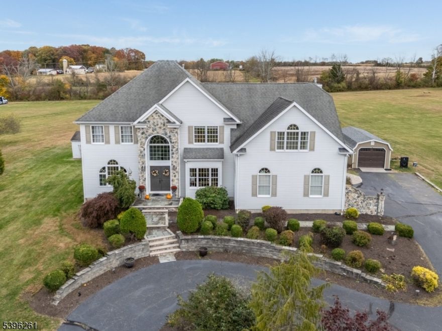 CUSTOM BUILT COLONIAL perched on 2.74 acre lot on a private cul de sac surrounded by preserved land...Special Features: FIRST FLOOR OFFICE adjacent to full bathroom,  SECOND FLOOR FLEX SPACE with large storage closet...Open Floor Plan fills the home with soft natural sunlight and beautiful views from every window...First floor offers Formal Living Room and Dining Room that flow easily into the Light Filled Kitchen and Breakfast Area which are open to the Family Room with gas fireplace...Elegant designer kitchen with granite countertops and center island seating for 4-6 and custom cabinetry,2019.  Relax and rejuvenate in the large PRIMARY SUITE, updated bath with radiant heat, 2019.  Three additional bedrooms, each with spacious closet and countryside views. Laundry room on second floor as well as an extra room that could be used as an office, library, craft room, exercise area or other as needs of the owner change. Finished lower level has plenty of space for a variety of uses, storage closets and a mechanical closet.  Enjoy the expansive backyard space that includes composite deck, paver walkway to seating area around firepit, plenty of grassy area for play.  Creekview Meadows is an enclave of 16 custom homes bordered by the Nishisackawick Creek and Preserve on one side and preserved farmland on the other. Move Right in to this TASTEFULLY UPDATED HOME and enjoy some of the most AMAZING SUNRISES AND SUNSETS in the HUNTERDON HILLS!