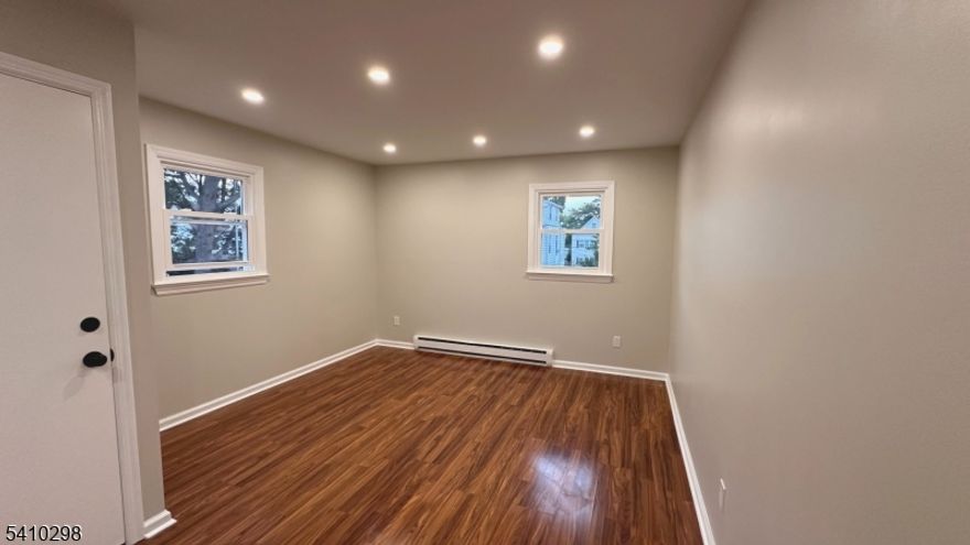 This beautiful,  second-floor apartment offers a bright, functional living space in a desirable Athenia section. The layout features a comfortable living room, a spacious eat-in kitchen, two bedrooms, and two updated full bathrooms. The kitchen is designed with functionality in mind featuring a walk-in pantry for excellent storage. Additional conveniences include an in-unit washer and dryer, recessed lighting, and attic storage for items you want tucked away.. Located near shopping, schools, and major highways, this apartment delivers both practicality and accessibility in a well-established neighborhood. A well-maintained, move-in-ready home in a prime location. No pets. No smoking.