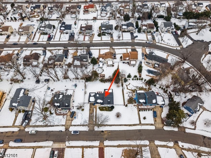 Welcome to this spacious split-level home located in desirable Middletown Township (Red Bank mailing address), offering exceptional value and flexibility at this price point. Upon entry, you are greeted by a bright living and dining area with soaring cathedral ceilings. Just a few steps up are three bedrooms and a full bath. The lower level expands the home's versatility with a second kitchen, an additional bedroom, and a separate living area, providing flexible space for a variety of living needs. This level also leads to a basement area with direct access to the attached one-car garage, offering ample storage and potential for future finishing. One full bathroom has been completely remodeled. Hardwood flooring runs throughout much of the home, with additional hardwood flooring beneath the carpeting in the bedrooms. A newer roof installed just two years ago adds long-term peace of mind. Off the main kitchen, a spacious deck overlooks the fenced-in backyard, perfect for outdoor entertaining, while the screened-in sunroom provides additional usable living space. The home offers an excellent opportunity to update and customize while building equity. Ideally situated just off Route 35 and minutes to the Garden State Parkway, shopping, dining, parks, beaches, and Red Bank's vibrant downtown.