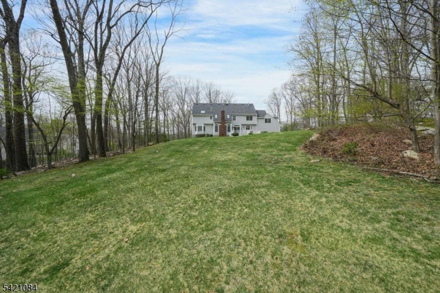 This beautifully maintained Colonial sits on a quiet, sought-after cul-de-sac in desirable Chester. A classic exterior welcomes you into a grand two-story foyer and bright, inviting living spaces designed for both everyday living and entertaining. Hardwood floors and a well-designed layout add warmth and functionality throughout.The main level features a dramatic two-story great room with fireplace, formal living and dining rooms, a mudroom, laundry room, and a dedicated home office ideal for remote work or study. The custom kitchen offers a Viking oven, granite countertops, and a center island with seating, seamlessly connecting to the main living areas for easy gatherings.Upstairs, the spacious primary suite provides a peaceful retreat. Three additional bedrooms offer generous closet space and share an updated, freshly painted bath. An oversized bonus family room with a back staircase adds flexibility for recreation, media, or additional living space.The finished lower level extends the home's versatility with abundant storage and space for a playroom, gym, or guest suite. Outside, an expansive, updated deck creates a private setting for relaxation and entertaining.Major updates include a roof (2020), deck (2021), and well pump (2017), offering peace of mind. Enjoy privacy with convenient access to shopping, dining, top-rated schools, and a short walk to the elementary school.