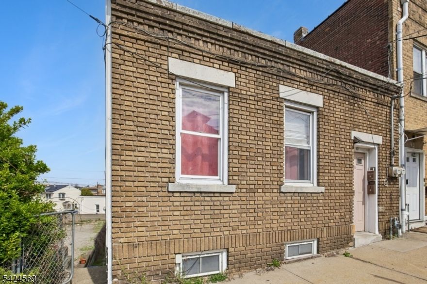 Great investment opportunity in Garfield! This multi-family property offers strong potential and is ideal for investors or owner-occupants looking to add value. The first-floor unit features 4 bedrooms, a large living room, and an eat-in kitchen, providing ample living space. The ground-floor unit includes a generously sized eat-in kitchen and comfortable living room layout. While some updates have been completed, additional TLC and updating will unlock the property's full potential. Prime location close to public transportation, plus convenient access to local shopping and everyday essentials. Plenty of on-street parking available. Don't miss this opportunity schedule your showing today! SQFT is approximate.