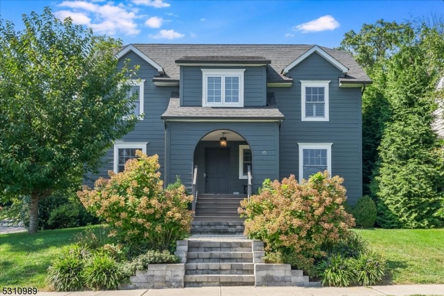 Experience unparalleled elegance in this breathtaking, move-in ready Center Hall Colonial located in the heart of Millburn's highly sought-after Wyoming section. Nestled on a private lot  this home features 5 bedrooms, 4 full baths, & 1 half bath across 4 thoughtfully designed levels. Completely gut renovated and expanded in 2017 w/ all new plumbing, windows, electric & roof this custom home offers high end designer fixtures, Restoration Hardware lights, recessed lighting and crown moldings throughout. The gourmet eat-in kitchen features custom white cabinetry, quartz countertops, Shaws farmhouse sink and top of the line Jenn Air appliances, w/ an expansive center island complete with 2nd sink. The kitchen seamlessly opens to the family room creating a warm and inviting layout. Upstairs you'll find the serene primary suite, featuring two walk-in closets, en-suite bathroom designed with a custom dual sink vanity w/ marble countertop, marble tiled floors, Restoration Hardware sconces and glass encased shower. An additional 3 generously sized bedrooms complete the 2nd floor, including a full bathroom w/ Restoration dual sink vanity & Ann Sacks tiling. The private 5th bedroom is found on the 3rd fl w/ full bath. The finished lower level boasts a versatile recreation room, flex space, ample storage & full bath. Step outside to your private oasis, where a spacious paver stone patio, new exterior lighting & landscaping create an ideal setting for outdoor entertaining & relaxation.