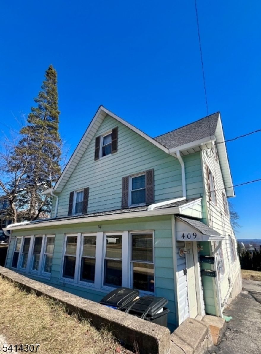 this Duplex has so much to offer large rooms lots of space and storage, hardwood floors, updated kitchens, front closed in porch, fireplace, off street parking, nice views, new roof gutters coming, finished basement in first unit don't miss it and more