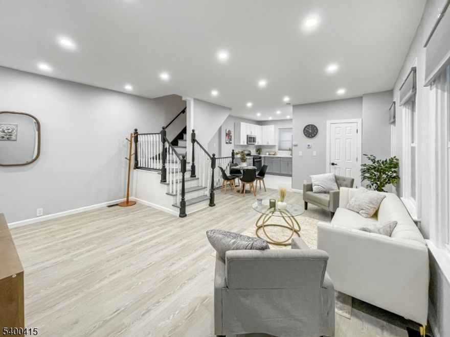 Your home search ends here! Blending classic charm with contemporary living, this beautifully colonial offers seamless modern convenience and sophisticated, tasteful finishes. Enter to a large open concept main level, offering a generous living room and dining space, and a fully modernized chefs kitchen. This level has a bedroom towards the front of the home that can serve many purposes - guest room, den, home office, etc. A sleek powder room completes this level. The second floor offers three bedrooms with ample closet space, and a beautiful full bath with shower and soaking tub. Down to the basement you'll find a huge rec room, offering more living, entertaining, and work space. You also have a large unfinished area with all your utilities and ample storage space. Outside, the backyard is ideal for entertaining, complete with a large deck and grassy yard. Plenty of off-street parking available with an extra long driveway and detached garage. The home is conveniently located near GSP and I-78. NYC commuters have public transportation available right on the corner of the street.