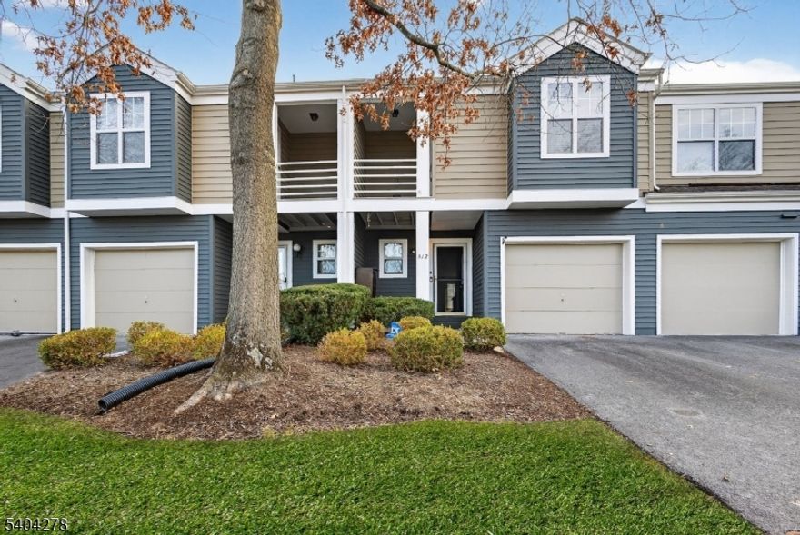 Welcome to this completely renovated 3-bed, 2.1 bath townhome in the highly sought-after Crossroads community, perfectly situated in one of the best locations backing to a private, wooded lot for exceptional privacy. This freshly painted home features an open floor plan with engineered wood floors throughout, creating a warm & modern feel. The main level offers a spacious living & dining area with recessed lighting & a cozy wood-burning fireplace. The beautifully remodeled kitchen (2024) showcases quartz countertops, newer stainless-steel appliances, extra cabinetry, & excellent workspace for cooking and entertaining. Sliding glass doors from the living room lead to a private patio overlooking a peaceful open lot. The second floor boasts a large primary bedroom with a private balcony, walk-in closet with custom organizers, and an updated en-suite bath with double sinks. Two additional generously sized bedrooms feature ceiling fans, and the conveniently located second-floor laundry adds everyday ease. The hallway bath is updated with a modern vanity and soaking tub. The finished basement expands your living space with engineered wood floors, a stylish bar with quartz countertop, and a media room ideal for entertaining or relaxing. Additional highlights include Blue Ribbon schools and a prime location close to shopping, dining, NJ Transit, and major highways including I-287, I-78, Routes 202, 206, and 22. A move-in-ready home offering privacy, style, & unbeatable convenience.