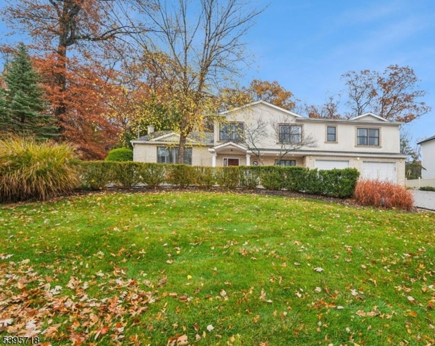 CLASSY & TIMELESS 5-Bed 3.5-Bath CUSTOM HOME boasting 3600+ sq ft.  Located in Livingston's most sought-after RIKER HILL neighborhood amongst multimillion-dollar homes. Perfectly situated on over 1/2 acre POOLABLE and PRIVATE lot backing to protected Green Acres land offering serene & wooded views- Yet, convieniently located around the corner from Elementary school & NYC Bus. The inviting foyer opens to a HIGH CEILING Living Room and Formal Dining Room with an easy flow into a chef's EAT-IN kitchen featuring SS Appliances, a large center island and TWO wine coolers. DESIGNER Appliances include a SUB-ZERO refrigerator, CAPITAL professional-grade range, high-performance exhaust hood and MIELE DW. The open layout extends to DUAL Family Rooms with walk-out to an expansive 3,000+ sq. ft. Custom PAVER Patio - ideal for ENTERTAINING. Upstairs hosts all FIVE bedrooms, including a luxurious Primary Suite with two walk-in closets and a SPA-like bath featuring RADIANT heated floors, heated towel rack, Air Tub & Large Stall shower + a Bright En-Suite PRINCESS Bedroom with its own full bath and Double Outfitted Closet. Extra Features: Custom moldings, architectural details, outfitted closets in every bedroom, second-floor laundry, whole-house water filtration & softening system, main-level garage with mudroom & large paver circular driveway. Enjoy the warm elegance of this home - All within a top-rated school district! Move Right In and Enjoy Life in Livingston!