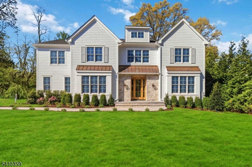 Exceptional New Construction by Clear Brook Properties. Poised on a serene .71-acre cul-de-sac, this architectural masterpiece spans over 7K sqft. of bespoke luxury. Beyond the striking copper roofing and flickering gas lanterns, discover an interior defined by 7" white oak engineered flooring and exquisite millwork. The heart of the home is a true gourmet's kitchen featuring a Wolf/Sub-Zero suite, an expansive center island, and a dual-pantry system (Walk-in + Butler's). It flows seamlessly into a family room anchored by an oak-coffered ceiling and beverage nook opening further to a massive with a full outdoor kitchen. Key Highlights: Primary Sanctuary - A massive retreat featuring three walk-in closets and a radiant-heated, spa-inspired bath. The Lower Level: An entertainer's dream with a custom Italian glass and climate-controlled wine cellar, professional gym, custom bar with quartzite countertops, custom built-ins for the entertainment area, and a flexible "Simulator Room" for golf or cinema. Modern Tech: Whole-house generator, EV charging station, and radiant heating in all baths, mudroom, and laundry. With 7 bedrooms and 6.5 baths, this custom home blends timeless quality with 2026's most sought-after amenities. This home is a must-see!