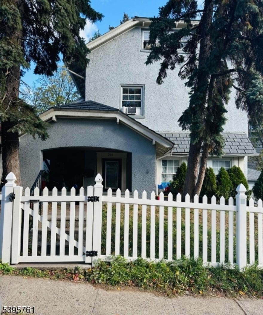 Welcome to this beautiful custom home nestled in the heart of Orange. A classic picket fence and tall trees frame the inviting entry, leading you into a spacious foyer and a light-filled living room. The large eat-in kitchen, complete with stainless steel appliances, is ideal for any home chef and perfect for entertaining. A formal dining room with distinctive molding adds timeless character. Upstairs, generous bedrooms offer comfort and space, and the owner's suite features a walk-out iron balcony the perfect spot to start or end your day. Outside, the private fenced backyard provides a lovely backdrop for summer cookouts and quiet evenings. This home is fully livable and ready for its next owner's personal touch. With just a little TLC, it can truly shine! Conveniently located near mass transit and major highways for an easy commute. Home is being sold as is. Don't miss this fantastic opportunity to make it your own!