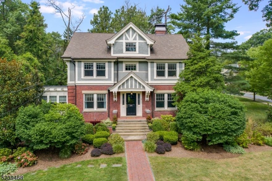 Dream home alert! Vintage charm, elegant craftsmanship and modern amenities abound in this beautifully restored historic colonial in Maplewood's prestigious Roosevelt Park section. 7 Bedrooms, 5.1 Baths for approximately 4,500 sq ft living space on an oversized corner (.37 acre) lot. Built in 1908, in 2012 this historic home was renovated to combine old world charm with every modern convenience. Featuring an open layout, sun-drenched rooms, original woodwork, pocket doors, coffered ceiling, and period details/moldings throughout. Spacious Foyer. Gorgeous Music Room/Library. Elegant Living Room with a stately fireplace and original built-ins. Spacious formal Dining Rm. Office/Sun Rm with extraordinary built-ins and garden views. Gourmet Chef's Kitchen with extensive custom cabinetry, high end appliances, stone countertops throughout, Island/Breakfast Bar, and dreamy breakfast area. Luxurious Primary Suite and spa-like Bath with tub, shower, and elegant finishes. All other bedrooms feature natural light, generous closets and large windows (3 on 2nd level, 3 on 3rd level). Beautiful baths throughout. A finished lower level with a Recreation Rm, Media Rm, Exercise Area, Laundry Rm, and full Bath. Magical backyard with bluestone patio, exquisite brickwork and meticulous landscaping. Prime location 2 blocks to Village/Train and access to top-rated schools, parks, shopping, and restaurants. Get your buyers in asap showings only on Thursday and Friday. Accepting backup offers only.