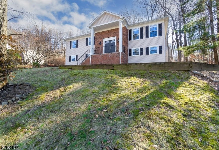 Look no further! WELCOME HOME TO 26 DEER RUN DRIVE in one of the most sought out towns in Morris County!  Magnificent Bi-Level w/numerous updates! Pride of craftsmanship is exhibited everywhere in this beautifully updated home on a simply magnificent piece of property. Be ready to be WOW'D as you enter through the double front doors w/custom therma-pane windows. Fresh newly painted walls throughout! Brand new finish on the stunning hardwood flooring throughout the Front Foyer, Stairs, DR, LR, Kitchen & Bedrooms. UPDATES GALORE! The kitchen is every chefs' dream.  Quartz Countertops w/full Subway tile backsplash is the focal point of this incredible room which features stainless steel appliances, deep stainless steel sink, and slow closing drawers and cabinets below counter.  Enjoy an open floor plan and seamless transition between the Kitchen, DR & LR which also features brand new recessed ceiling lights. Renovated Master Bath features a walk-in shower w/subway tile & decorative Mosaic tile w/recessed soap shelf. The Recreation Rm/FM located on the ground level offers a wide range of possibilities including a wood burning fireplace with a raised hearth mantel. 4th bedroom can also be used as an office! There is nothing to do but move in and enjoy living in this exceptional home. Located in one of Randolph's premier neighborhoods, in close proximity to top New Jersey schools. Easy access to great shopping & major highways for easy commuting, this home is not to be missed!