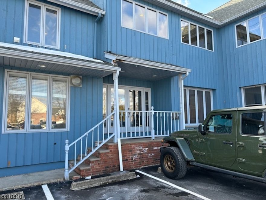 Large, Immaculate, first floor, two room office suite with  powder room.. Excellent in town location.