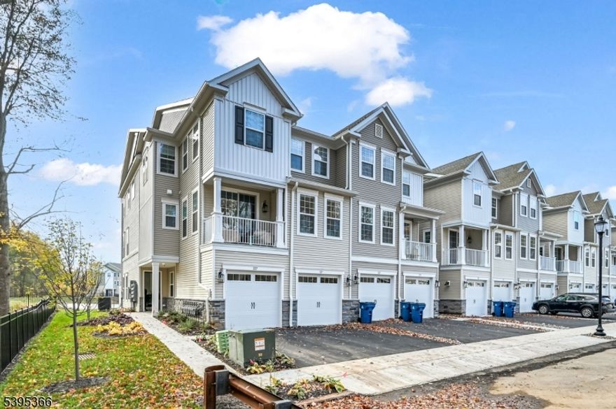 WOW! This stunning new construction 2-bedroom, 3 full-bath end-unit townhome, offering luxury living at its finest. Every detail has been thoughtfully designed with top-of-the-line finishes, a spacious open floor plan, and bright, sun-filled rooms throughout. Kitchen boasts elegant white cabinetry, gleaming stainless steel appliances, a custom hood vent, and a large center island with storage perfect for both entertaining and everyday living. The open-concept design flows seamlessly into the living room, featuring a gas fireplace and sliders leading to a private patio overlooking peaceful wooded views, creating the ideal indoor-outdoor living experience. Main level offers a convenient full bath, garage entrance, and extra cabinetry for smart storage. Upstairs, you'll find the luxurious primary suite with a spa-like bath that includes a stall shower with bench, dual vanity, and a walk-in closet with custom built-ins. The second bedroom and another full bath complete this level, along with the added convenience of second-floor laundry just steps from the bedrooms. Set in a highly desirable town known for its charm, top-rated schools, and easy access to shopping, dining, and major highways, this brand-new, never-lived-in home offers the perfect blend of luxury, comfort, and modern convenience.