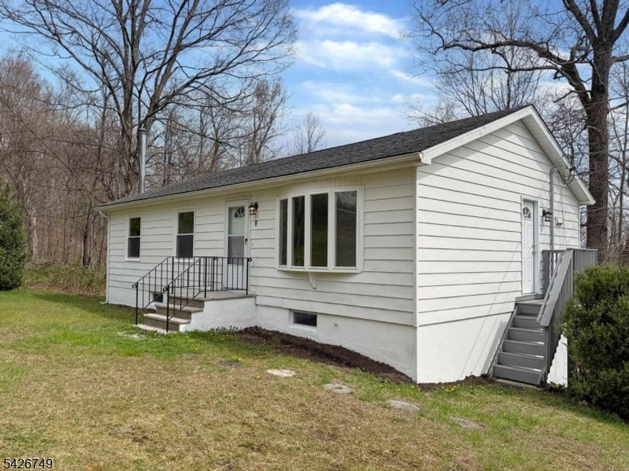 Welcome to 9 Fern Ct in Wantage, NJ, a newly renovated 3-bedroom, 2-bath raised ranch located on a quiet dead-end street. This move-in-ready home features a bright, updated interior with modern finishes and a flexible layout ideal for today's living. The main level offers a comfortable living space with access to a deck, perfect for relaxing or entertaining. The walk-out lower level provides additional living space and includes a wood-burning stove, creating a warm and inviting atmosphere for a recreation area or home office. Recent upgrades include a new well water filtration system and a refreshed septic system, offering added value and peace of mind. The low-traffic, private setting enhances the appeal while still being within reach of local amenities, shopping, and outdoor recreation. A great opportunity to own a turnkey raised ranch with a walk-out basement in a desirable Wantage location.