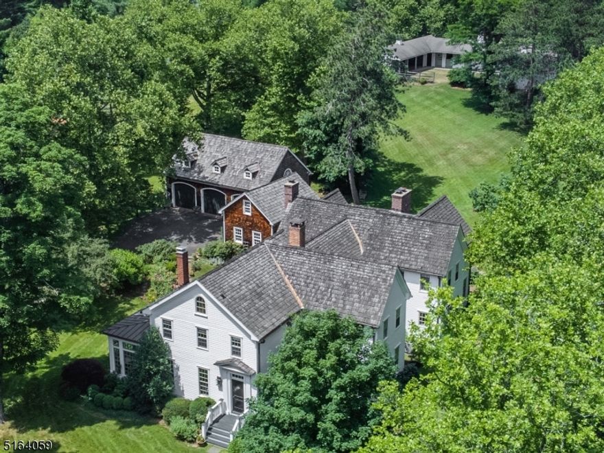 TRAP ROCK FARM is a bucolic country compound offering a magical blend of architectural heritage, modern conveniences and serene surroundings.  Poised above picturesque Youngs Road, the landmark property features a thoughtfully renovated and expanded four-bedroom main house, a three-car detached garage, stable with eight mahogany paneled stalls, three fenced paddocks, a large garden shed, a bluestone patio surrounded by established perennial gardens, a private yard and farm-assessed acreage.  Tastefully updated using materials such as reclaimed wide plank flooring, old brick, true divided light windows, copper gutters and hand-split cedar shingles, TRF marries pristine period architecture with today's highest quality materials.  Located less than 35 miles from Manhattan, TRF offers easy access to airports, highways and train.  Exceptional shopping, restaurants, entertainment and hospitals are minutes away in vibrant Morristown.