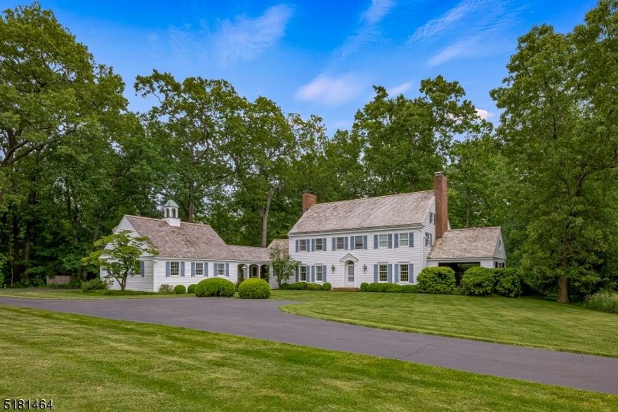 Tucked back from bucolic Youngs Road on ten plus pastoral acres, this custom-built ten-room Classic Colonial residence, designed by renowned New Vernon architect, Patrick Burke, offers comfortable country living. Scenic views are evident from every room. The Entry Foyer has two curved walls and a formal powder room. A handsome staircase leads to the second floor. The back-to-front living room features custom built-ins and a wood-burning fireplace. Two glass-paned doors lead to the spacious open porch. The custom-lighted formal dining room is to the left of the Entry Foyer. Plentiful cabinet space, a center island, built-in desk, informal dining area and sliding door to the backyard are highlights of the country kitchen. Opening from the Kitchen is the Family Room with cathedral ceiling, custom built-ins, and sliding doors to the backyard.  Completing the first floor are an informal powder room and laundry/mud room area. The mudroom leads to a brick-floored breezeway connecting to the attached two-car garage with office above. The Second Floor encompasses the Luxurious Primary Suite with wood-burning fireplace and en-suite bathroom. Additionally there are three more bedrooms and a Hallway Bathroom. The office, over the garages, is flooded with natural light. Recreation Room & dark room (could become wine cellar) are located in the basement. Another feature of this exceptional offering is a Detached 2-car garage with storage area. Fireplaces/Chimneys sold as is/no known issues