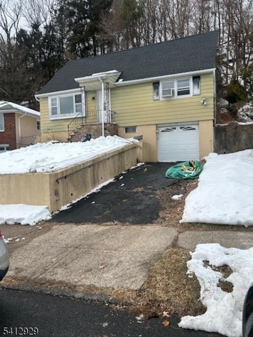 This classic Cape Cod style single family home offers the perfect canvas for investors, builders or buyers looking to create a fully customized living space. Located in one of Clifton's most convenient and sought-after neighborhoods, this property combines charm, potential and a prime location - all ready to be reimagined. The welcoming footprint with two levels of living space, has a full basement and a one-car garage. While the home requires renovations, it provides a solid foundation for modern redesign, possible expansion or full transformation. The cape cod architecture has classic lines and an adaptable interior layout with potential for open-concept redesign. The second floor expanded dormered area is ideal for bedrooms, office or studio. The full basement offers storage or future finished space. Located near local parks, schools and community amenities - shopping, dining and everyday conveniences. Major highways including Routes 3, 80 and the GSP offer easy commuting options to NYC and surrounding areas. This property is ideal for investors seeking a value-add project, contractors or builders searching for their next renovation project and buyers looking to design a home from the ground up.